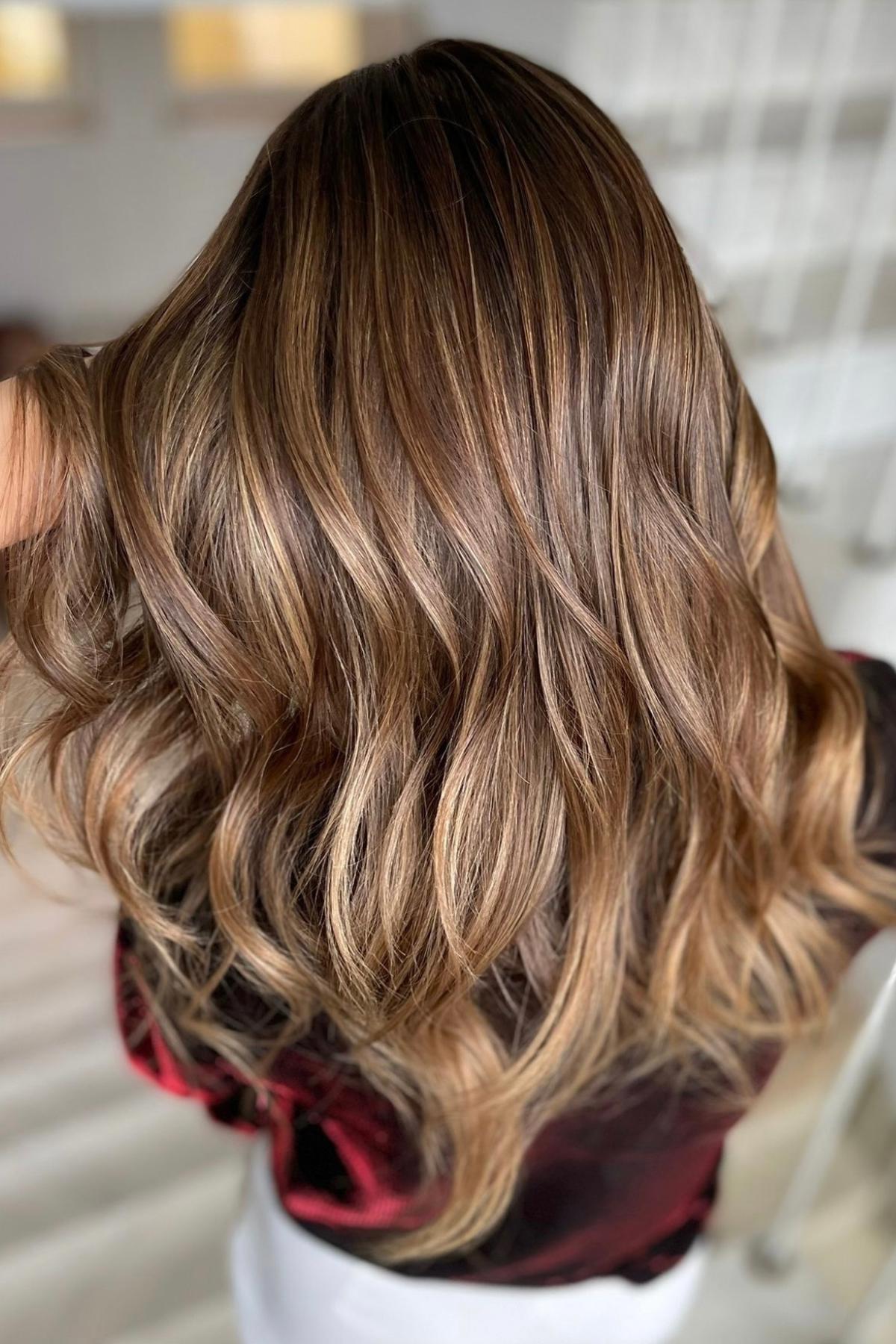 Natural sun-kissed balayage hair color at Conceited Beauty Bar in Lancaster, PA.